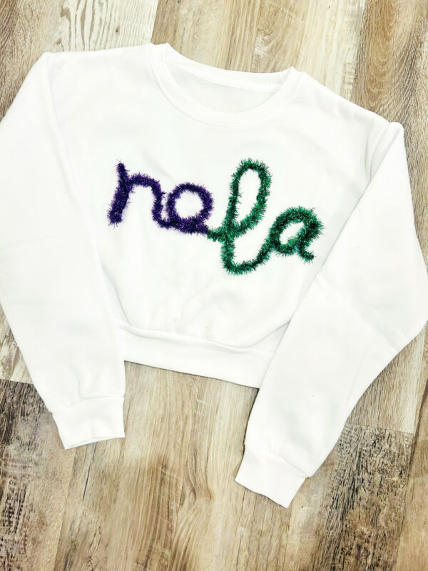 handcrafted white sweatshirt with NOLA custom yarn work