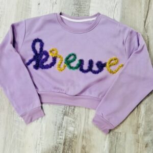 handcrafted purple sweatshirt with Krewe custom yarn work