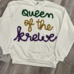 handcrafted white sweatshirt with Queen of the Krewe custom yarn work