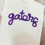 handcrafted white sweatshirt with Gators custom yarn work